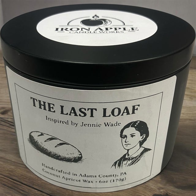 A black tin can of The Last Loaf candle by Iron Apple Candle Works